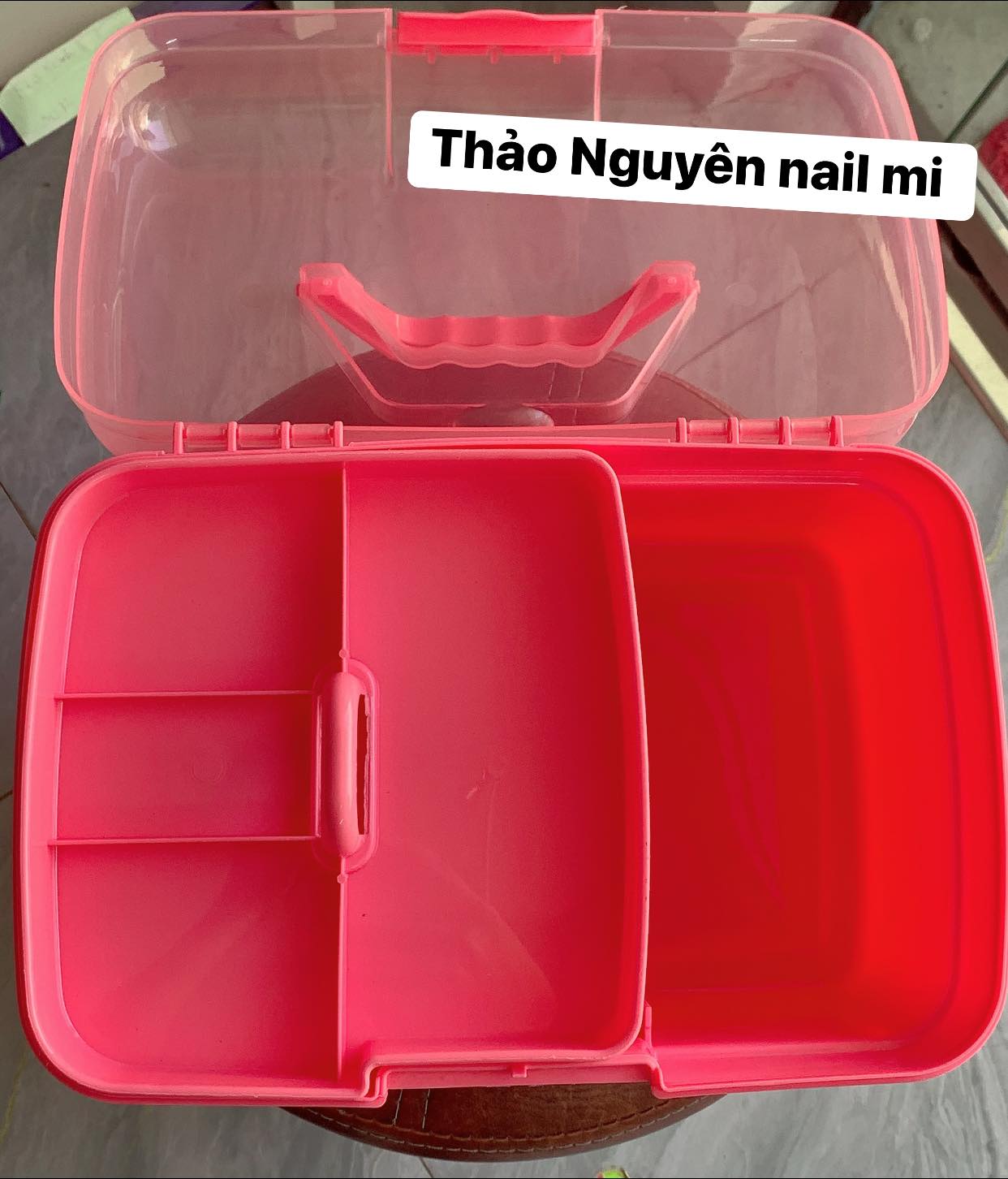 Plastic box for storing nail supplies.