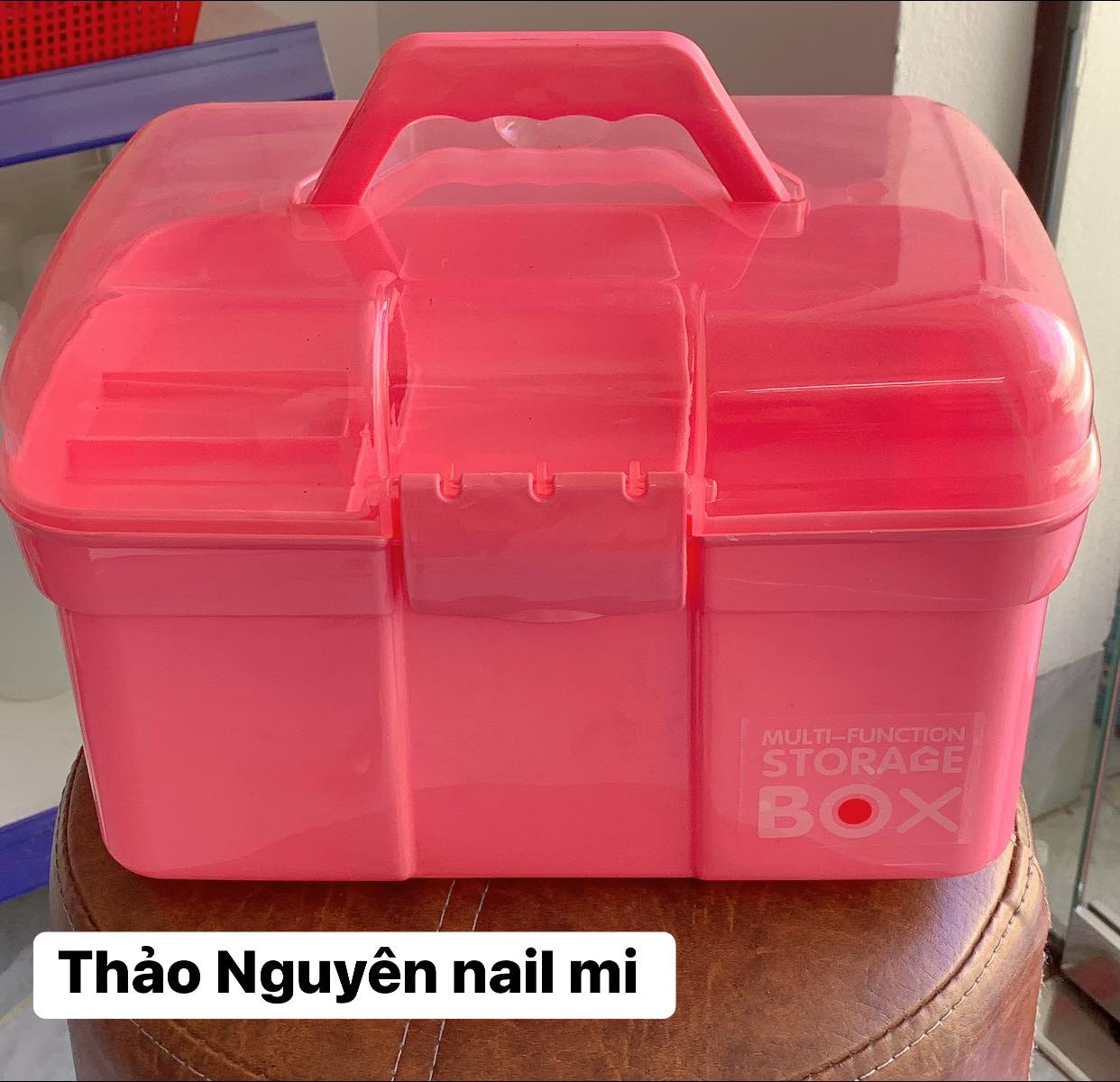 Plastic box for storing nail supplies.